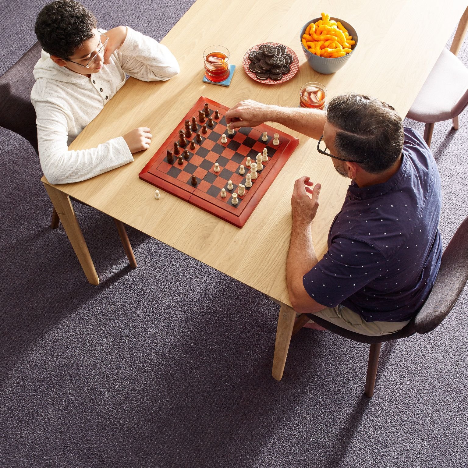 Two people playing chess - Kimple Carpet, LLC in Gettysburg