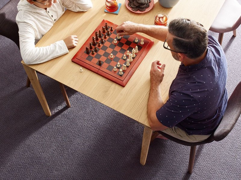 Two people playing chess - Kimple Carpet, LLC in Gettysburg
